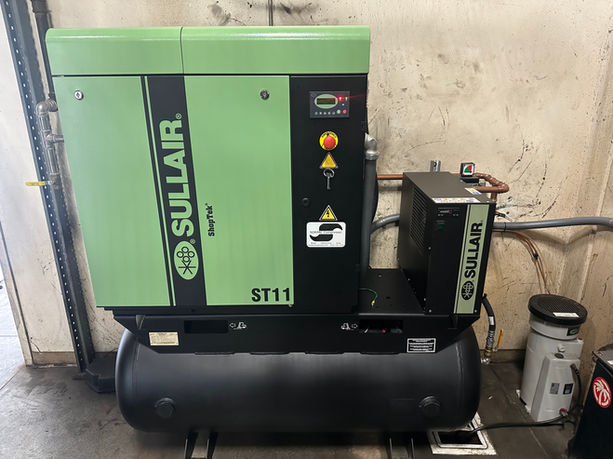 Sullair ST11 oil injected rotary screw air compressor with refrigerated air dryer.