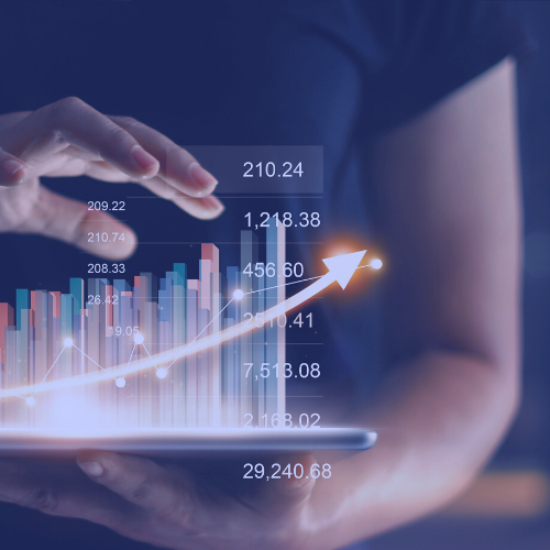 A woman holding a 3-D bar graph