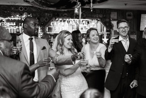 The wedding party share a toast on a wedding day