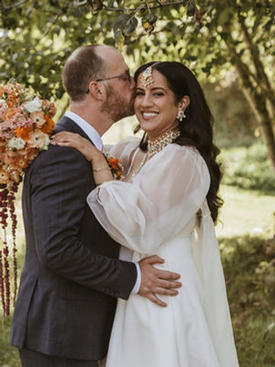 A groom kisses his bride on their wedding day in Montana