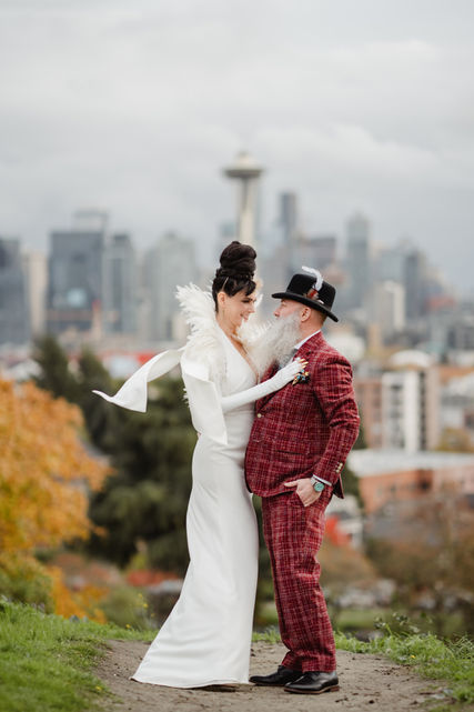 Bride and groom share a sweet moment with the Seattle Space Needle in the background