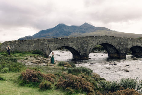 Bride and Groom pose together at the Sligachan Bridge