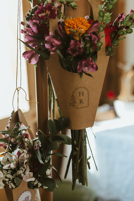 Custom monograms are featured on flowers at wedding