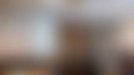 Henry Ting presents slides on leveraging reviews to a seated audience in a conference room. Text and images are on screen.