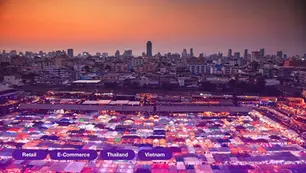 City skyline at sunset with vibrant market tents below, glowing in orange and purple lights. Text labels: Retail, E-Commerce, Thailand, Vietnam.