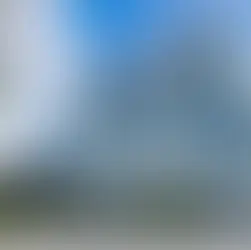 Modern glass building with "Telefonica" logo, blue sky, people walking below. Text overlay: "Telefonica Pushes for Scale as Europe Rethinks Telecom Rules."