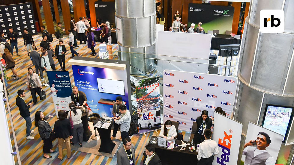 Crowded expo hall with people at CleverTap and FedEx booths, talking under banners reading dataAIX and rb in a bright atrium.