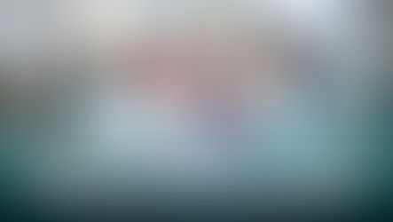 Business meeting with executives around a table, engaged and listening to a woman presenting slides. Text: "Executives Shift Focus to Adaptability."