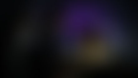 Three people in business attire discuss in front of a laptop. Purple digital map background with floating "AI" text, creating a tech mood.