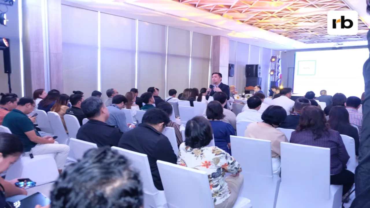 Capturing the moment of focus: Attendees dedicating their attention to the visual content displayed on the large presentation screen.