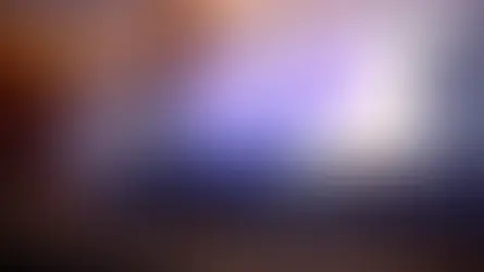 A woman speaks on stage with a backdrop displaying "WellBeing Capital: Strategic ROI of Employee Mental Health" in a modern conference hall.