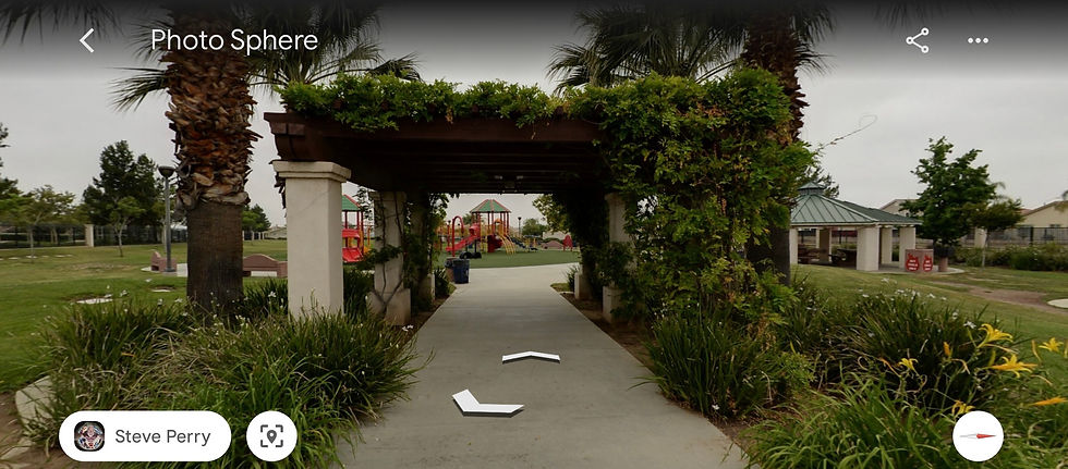 The cute pergola entrance with vines in Vista Lomas Park