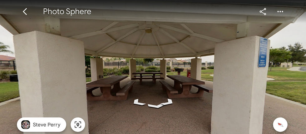 The park shelter, barbecues, and garbage cans at Vista Lomas Park