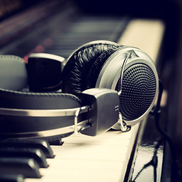 Piano keyboard with headphones for music.jpg