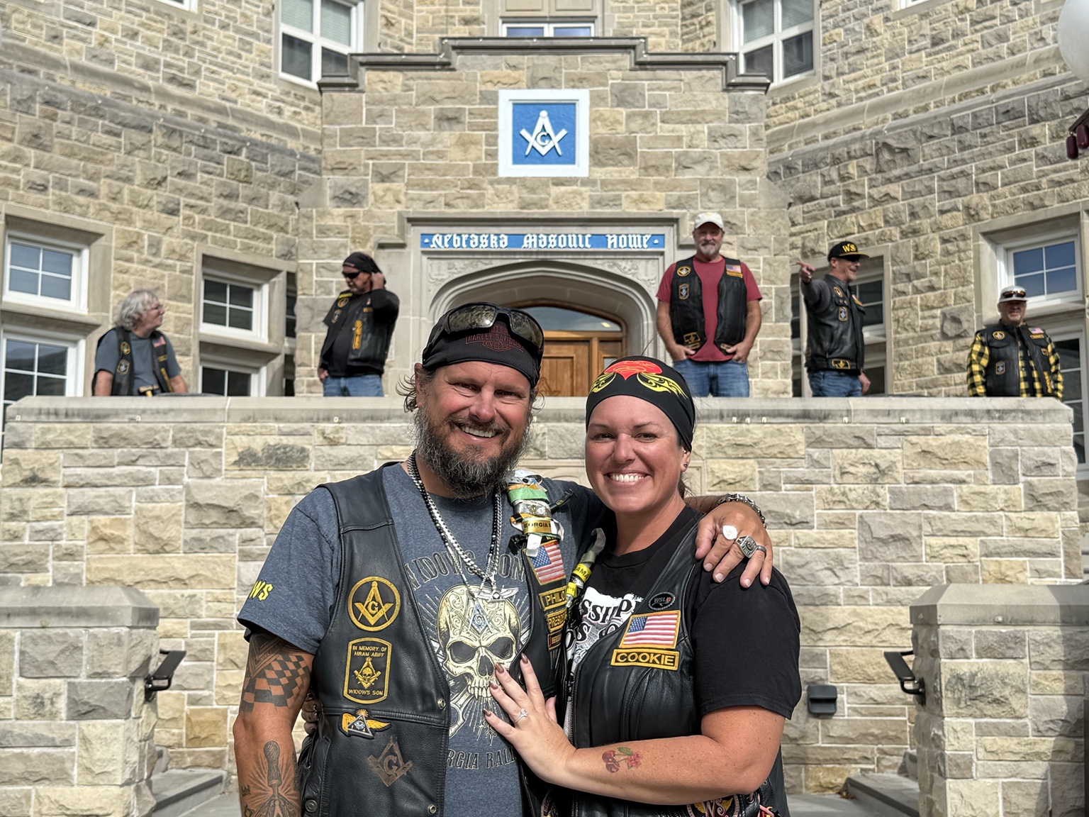 Philo and Cookie together outside the Nebraska Masonic Home with fellow riders