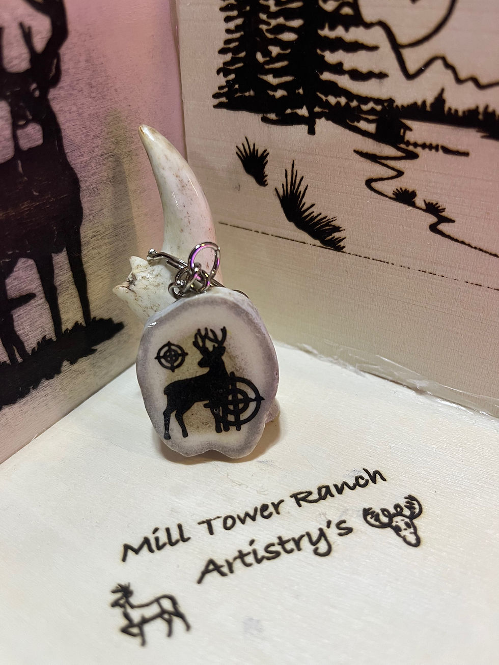 Deer take aim key chain