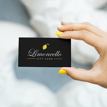 3.5x2 inch US business card in the hand of a woman_Limoncello Gift Card.png