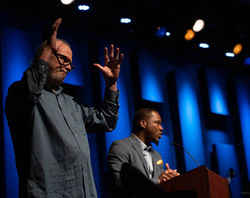 Interpreter at the side of a stage