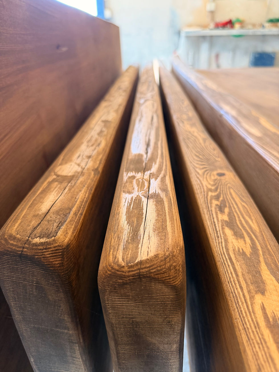 Hand-stained timber in a local carpenter’s workshop for bespoke joinery. For this project, I chose a deliberately hand-finished surface — uneven in places, with brush marks still visible — because it suited the house and the setting. Balanced with sleeker upholstery and softer modern furnishings, it gives the new pieces character without making the interiors feel rustic.