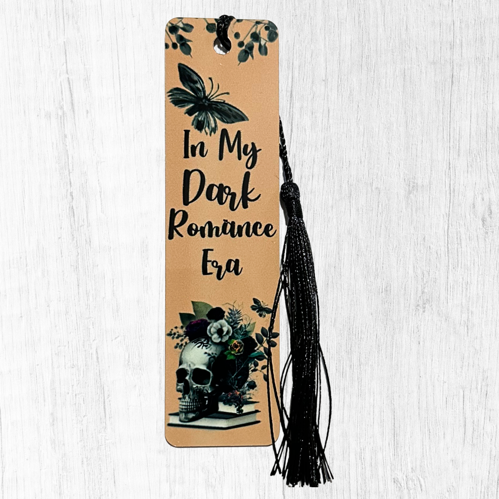 Dark romance era bookmark with skull, flowers, and black tassel