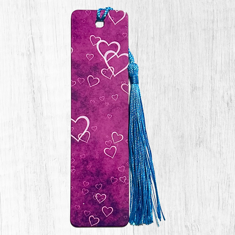 Pink and purple gradient bookmark with white heart outlines and blue tassel
