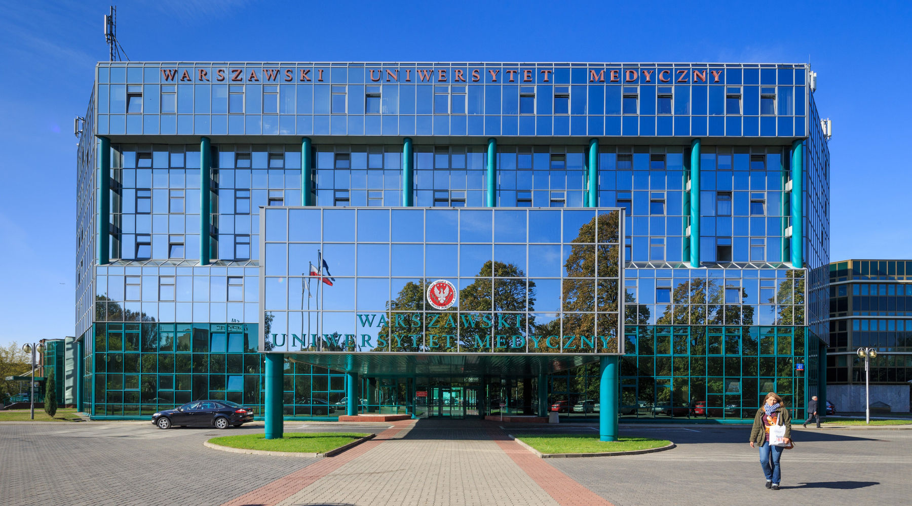 The Medical University of Warsaw teaching building, its name set in letters across the top of the glass facade