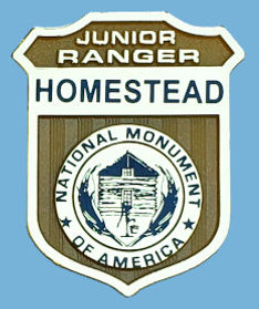 Homestead plastic badge.jpeg