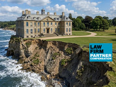 A law firm on borrowed time — coastal cliff landscape with the Law Firm Partner Compensation book