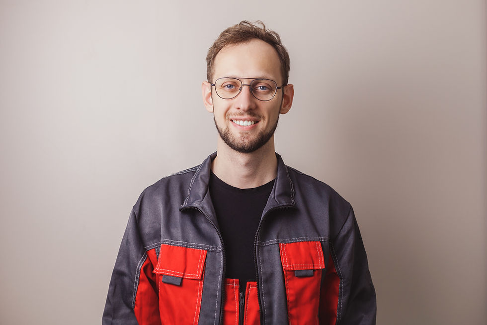 smiling-worker-man-portrait-on-gray-background-2026-01-08-05-19-54-utc.jpg
