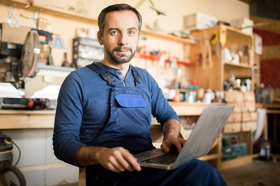 mature-carpenter-posing-with-laptop-2026-03-19-22-51-29-utc.JPG