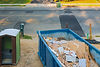 Blue construction debris dumpster used for Top Notch Junk Removal services in Salt Lake City.