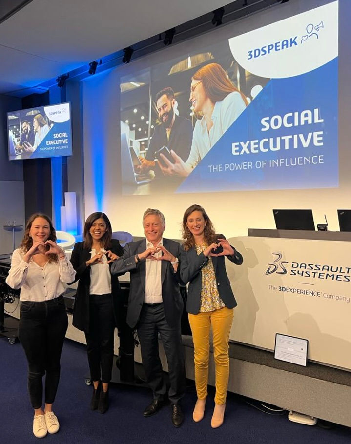 Leader and organisers of the conference standing in front of the stage