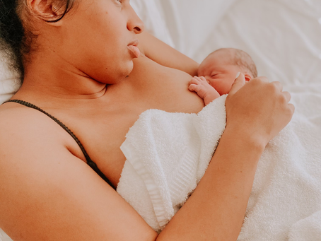 Houston area mother nurses newborn baby with doula support in the greater Houston, The Woodlands, Humble, and Spring, Texas