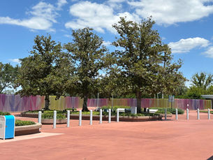 Colorful, geometric wall with images from EPCOT's Millennium Celebration