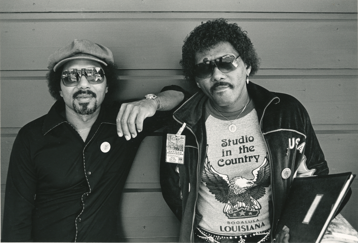Black and white image of two music icons