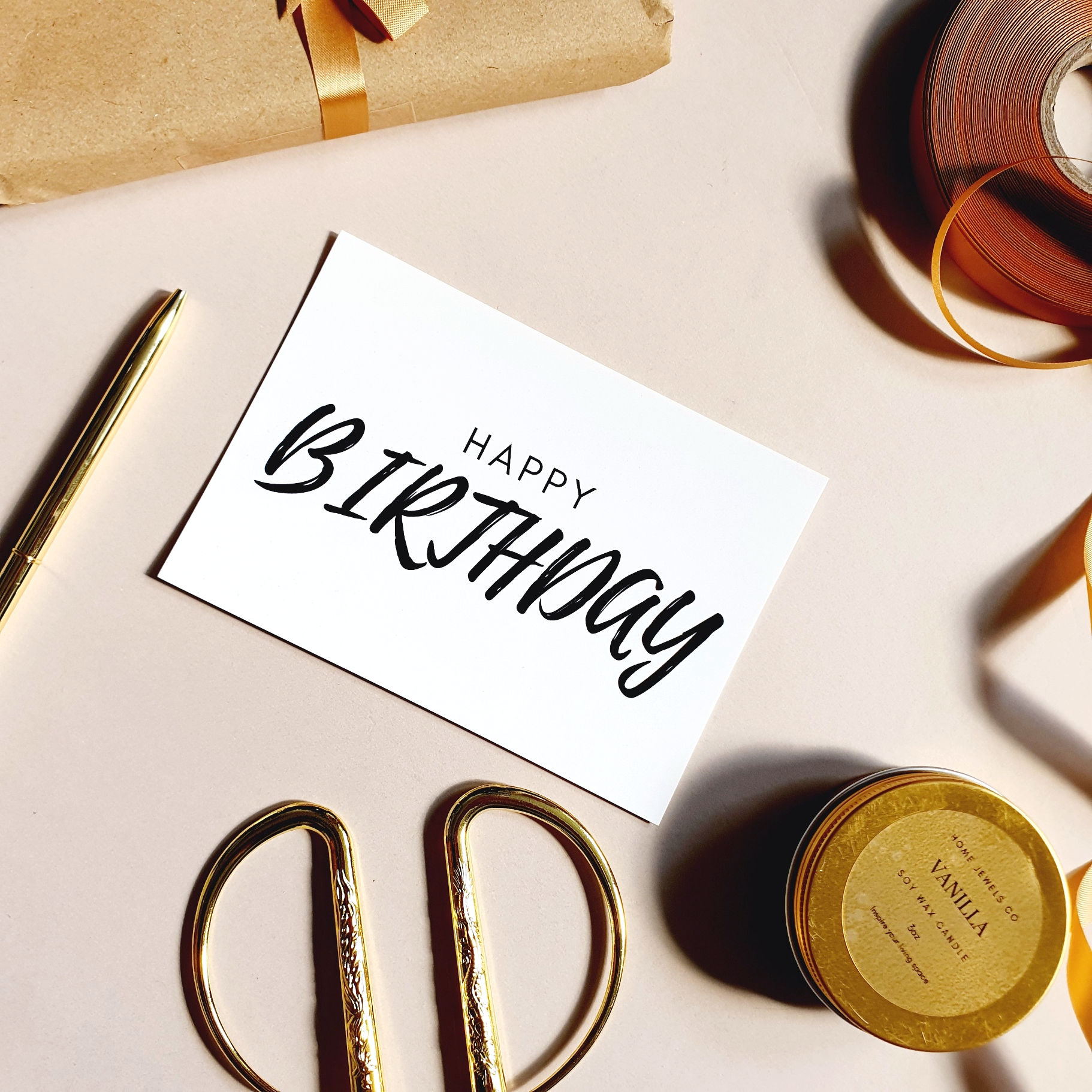 White High Gloss Birthday Notecard Surrounded by Gold Ribbon and Stationary