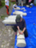 The team practicing knots and rolling techniques.