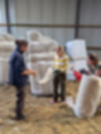 Emily, Kerry, and Robin (R to L) discuss the wool and ideas for the bunds.