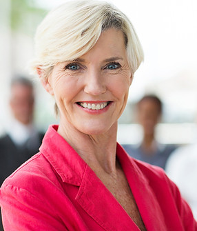 Smiling Older Businesswoman in Pink