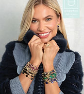 Woman wearing colorful enewton bracelet stacks at Angel's Cards & Gifts in New Hope PA