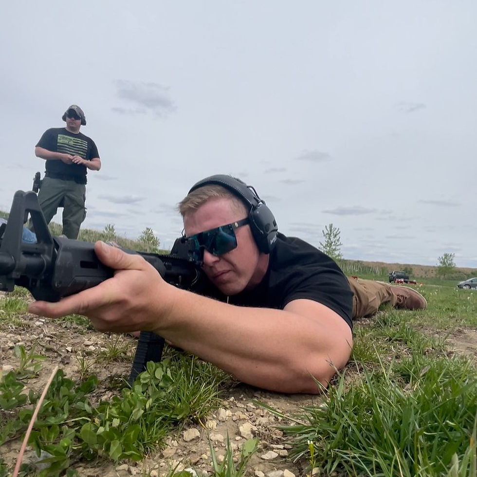 Eye-level view of a tactical rifle resting on a shooting bench