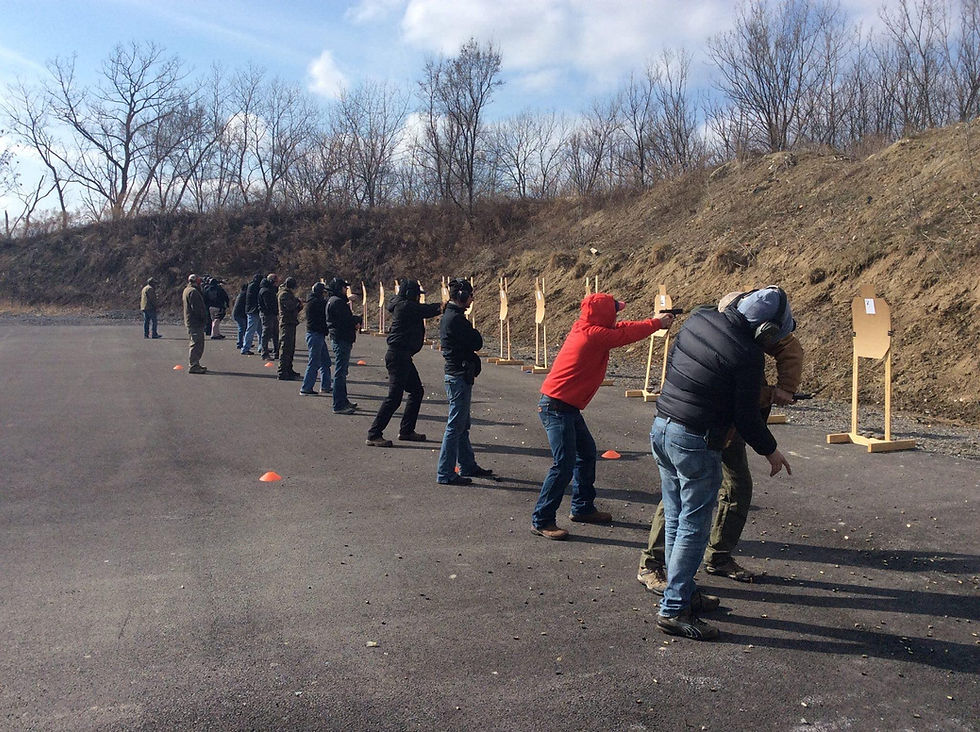 Eye-level view of a pistol on a shooting range bench