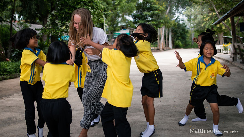 Participant playing with students during break time.jpg