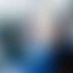 guests speaking with Tabby at the merch table