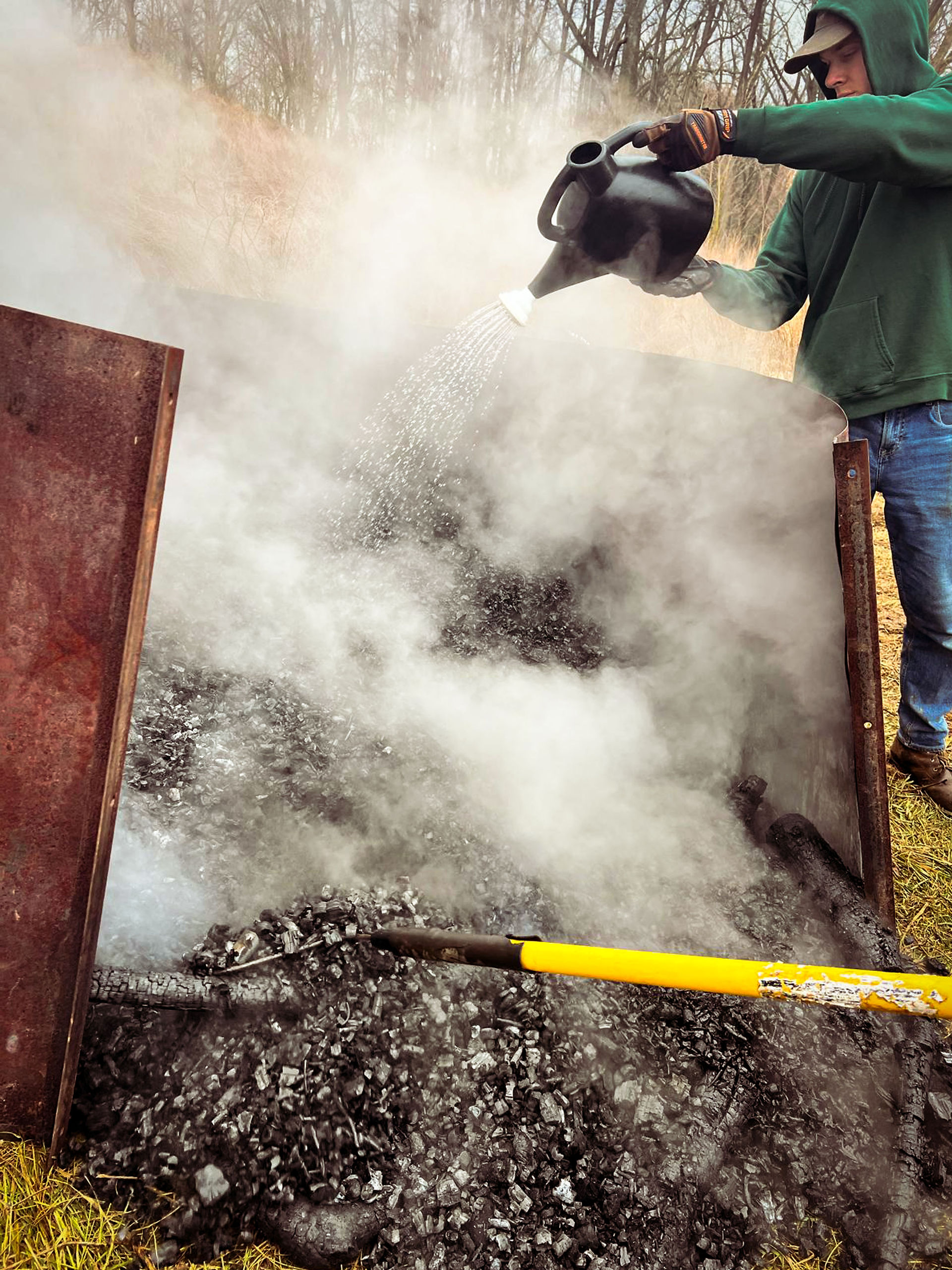 Raking out the finished biochar