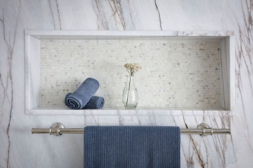 Calacatta Gold broken joint mosaic in shower niche