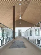 Glass balustrades at either side of outside walkway