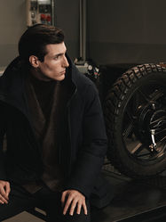 Male model wearing dark clothing