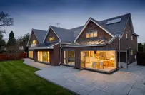 Modern house in the evening, lights on