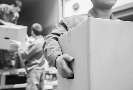 Movers unloading a moving van